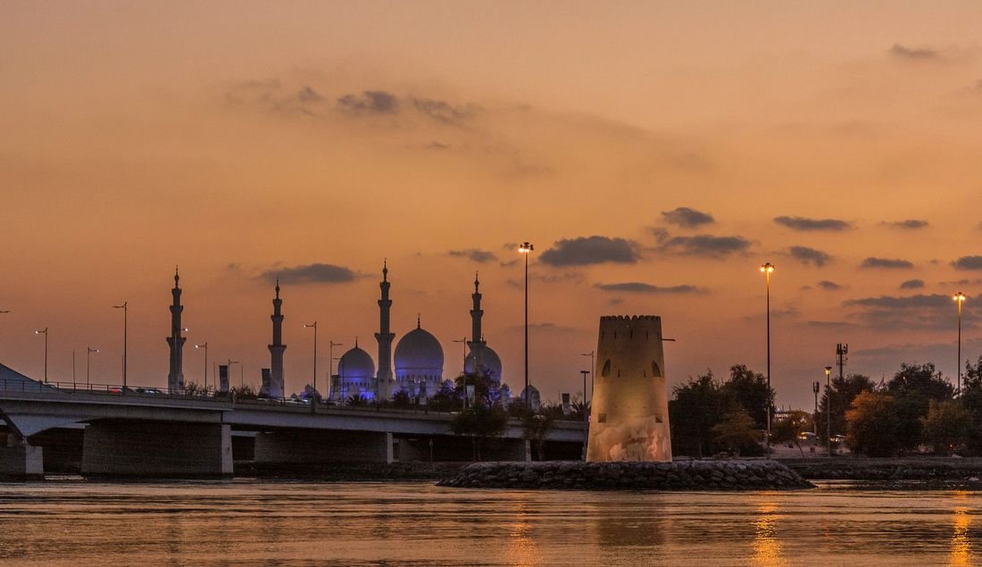 White domes and minarets of the Sheikh Zayed Grand Mosque in Abu Dhabi
