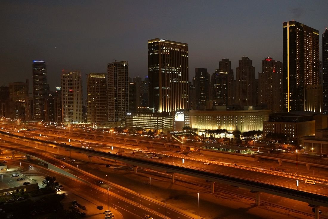 Sheikh Zayed Road and Dubai Marina towers at dusk