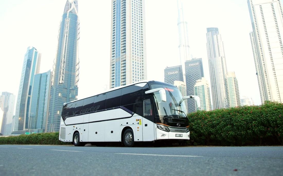 White King Long coach in Downtown Dubai with Burj Khalifa behind