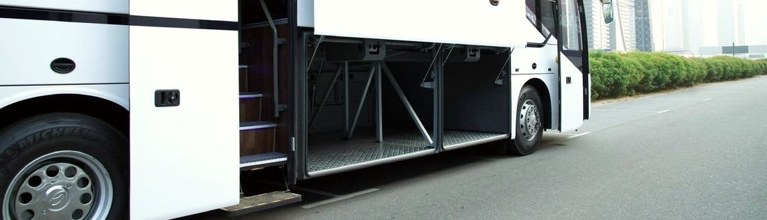 Coach from the Emirates Bus Hire fleet with both under-floor luggage bays open