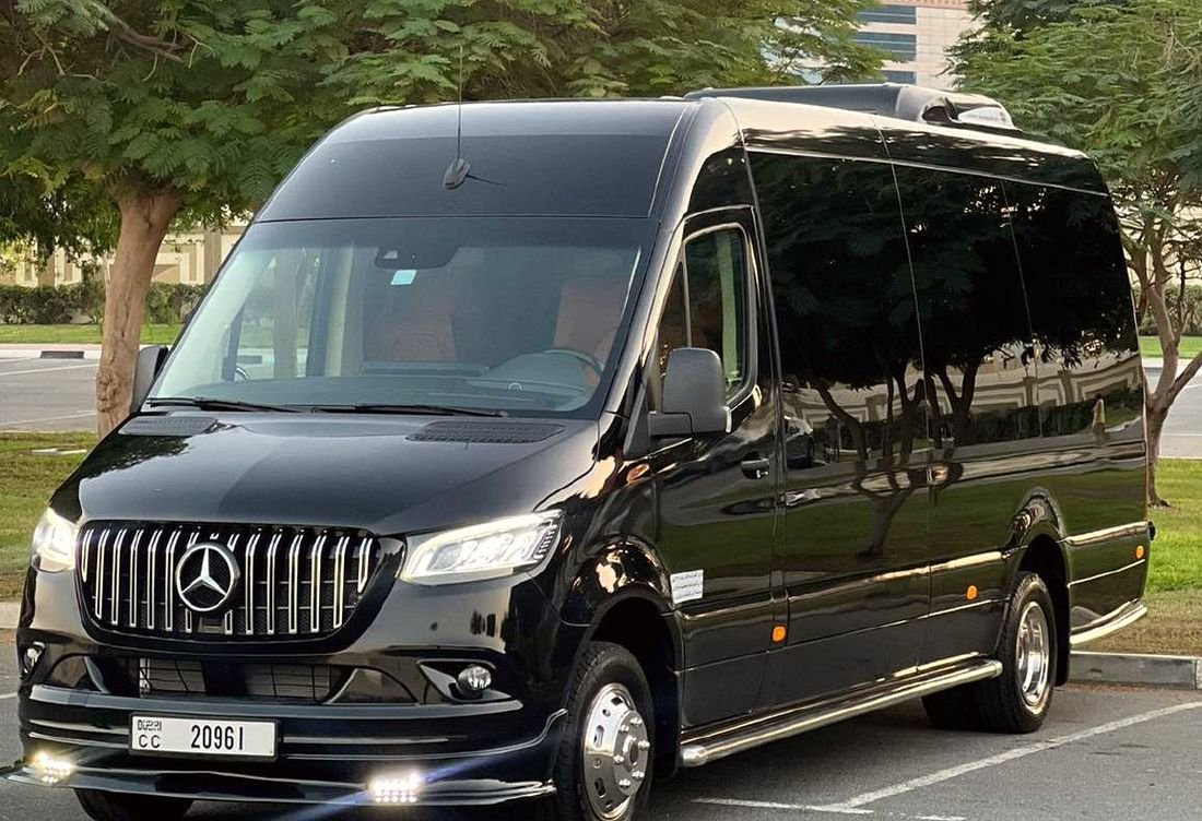Black Mercedes Sprinter minibus from our fleet at sunset