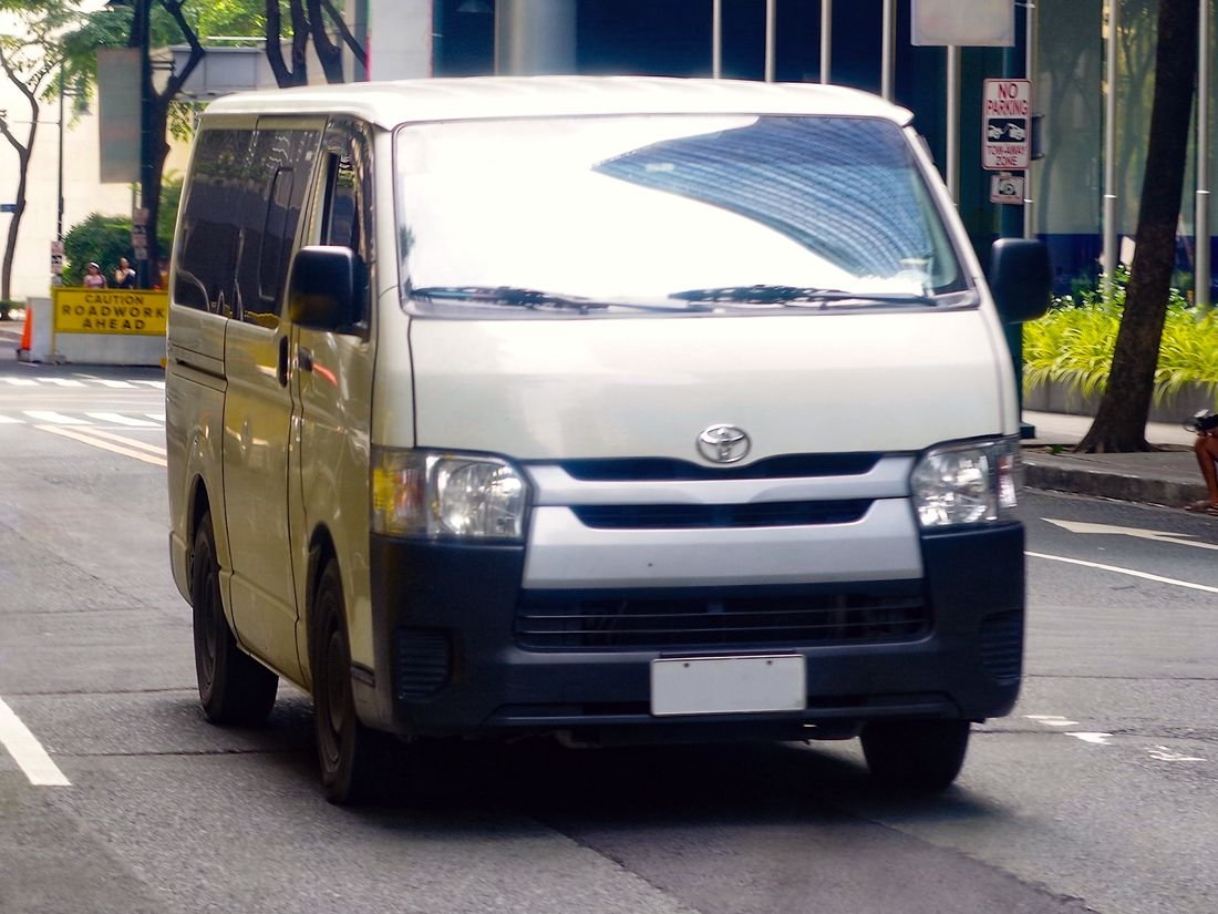 White Toyota HiAce passenger van