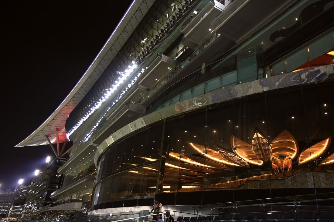 Meydan racecourse grandstand lit up at night